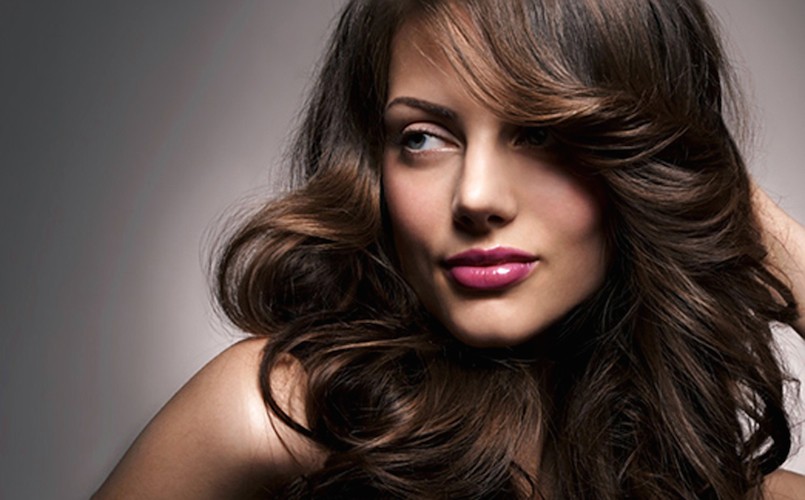 woman with brown hair and loose curls