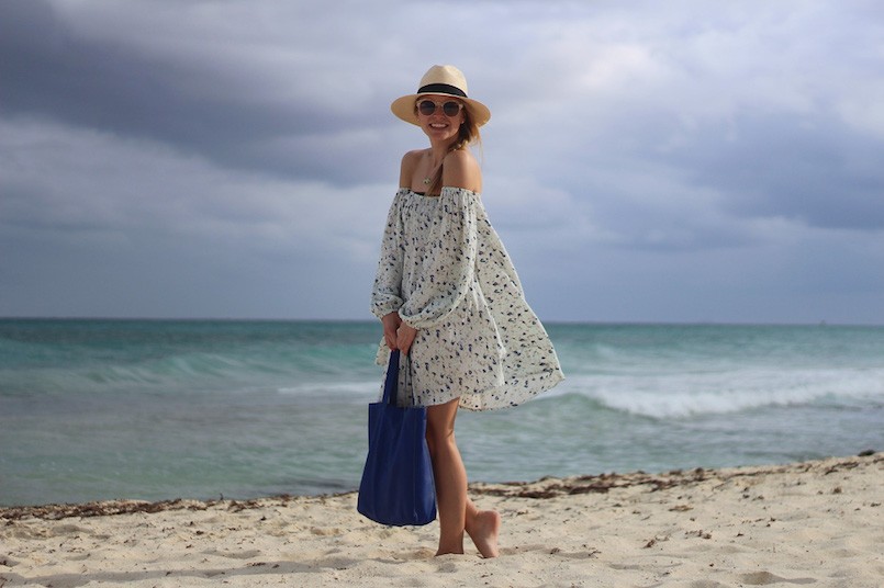 carrying a beach bag on the beach