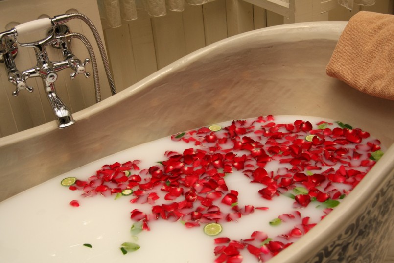 soaking in a body soak bath tub with rose petals