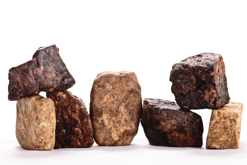 bars of African black soap on white background