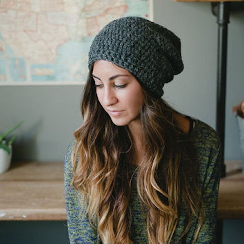 dark grey beanie on brunette hair
