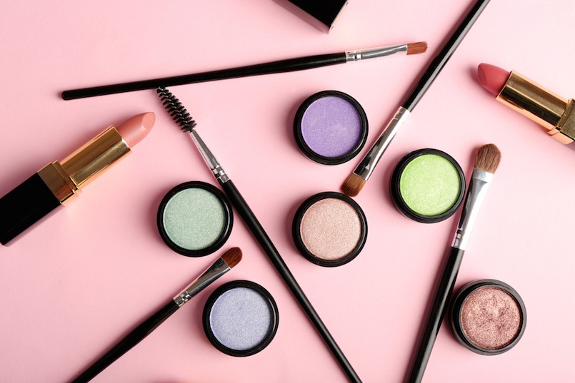 Set of decorative cosmetics on light colorful background