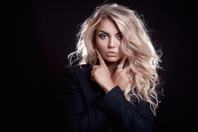 girl in black with blond hair