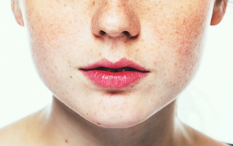 Lips and nose Woman freckle happy young beautiful studio portrait with healthy skin