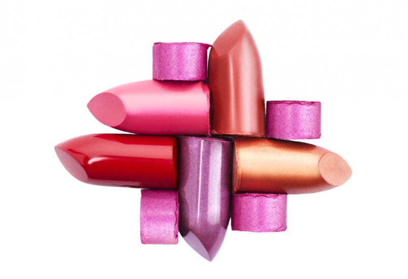 Several different lipsticks isolated on white background
