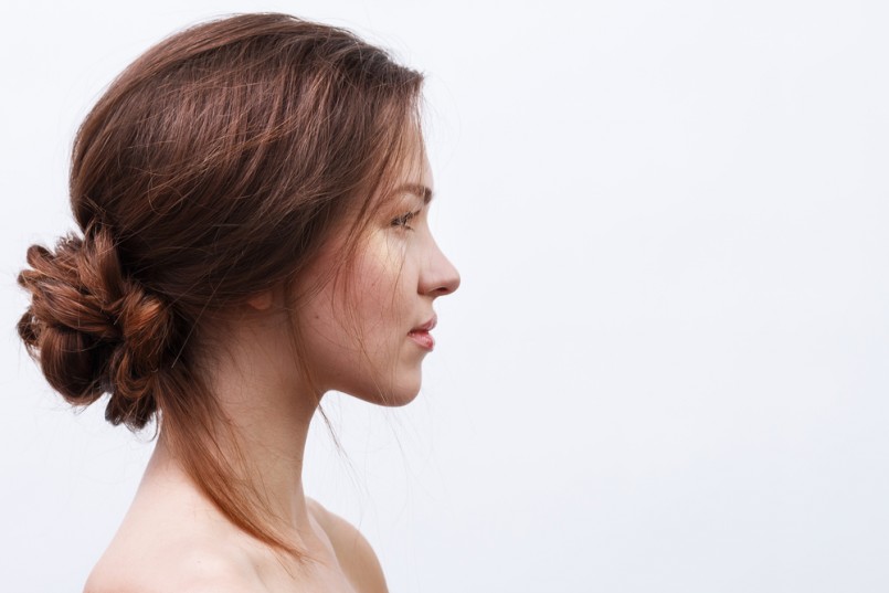 Beautiful woman with natural makeup and hairstyle
