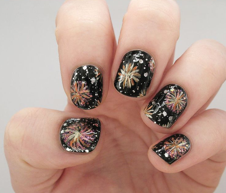 fireworks nail art on black manicure