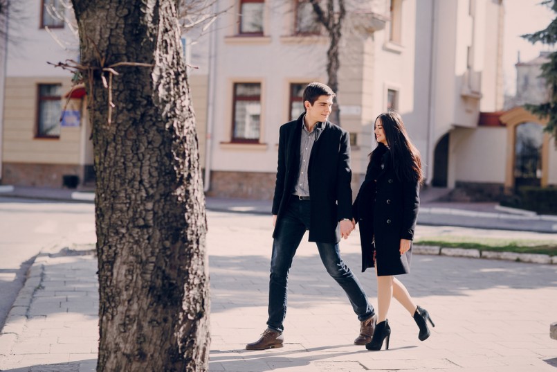 loving couple walking city