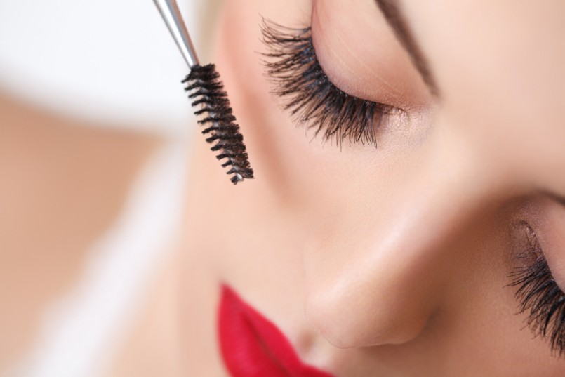 Woman eye with beautiful makeup and long eyelashes. Mascara Brush. High quality image