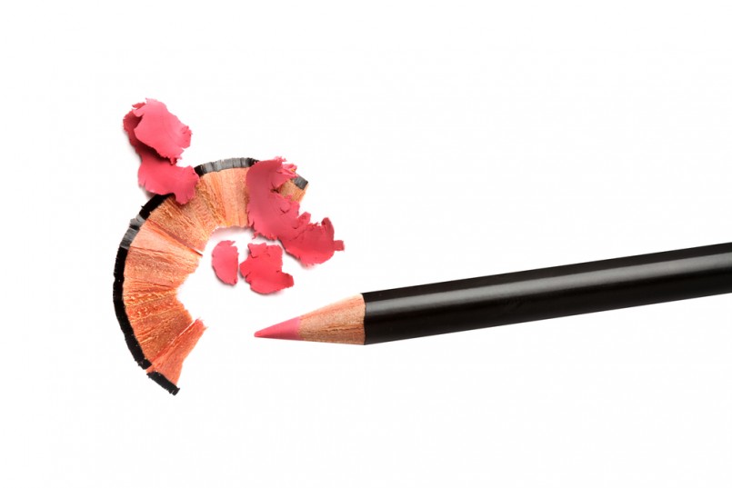Pencil cosmetic sharpening with husk on white