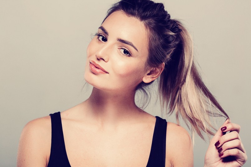 Beautiful young woman portrait smiling posing attractive blond