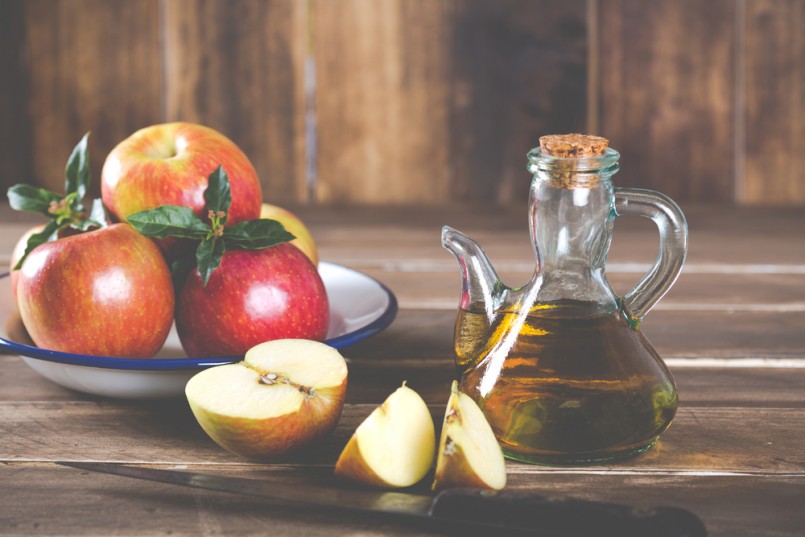 Homemade Vinegar galas apples on a table in a farmhouse