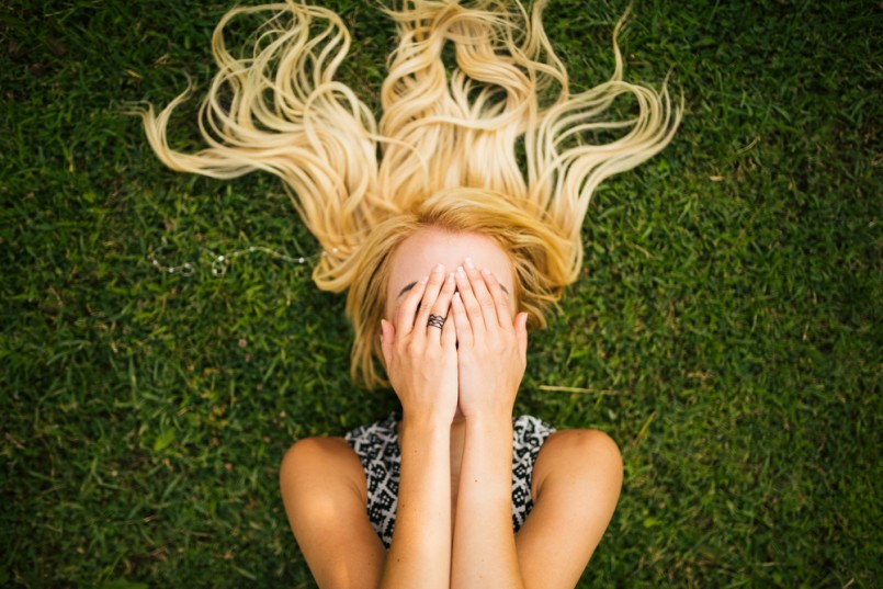 Young blonde woman summer day relaxing