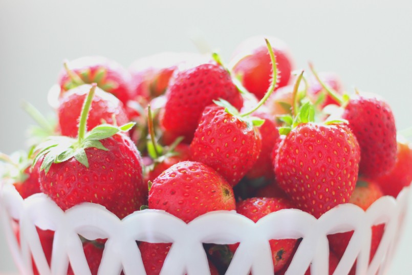 The strawberry in the basket with selective focus on the front strawberry