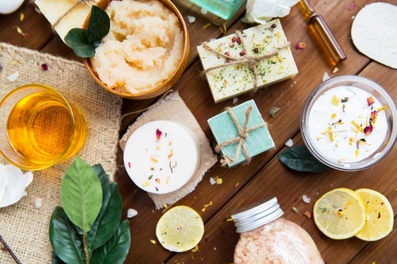 close up of body care cosmetic products on wood
