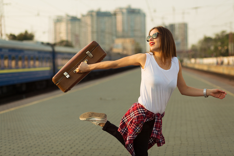 woman, fashion, outdoor, flannel, style, street, jumping, shirt, bohemian, sunglasses, travel, brown, wondering, walking, accessories, smiling, train, jeans, girl, suitcase, watch, waiting, hair, dancing, station, running, pretty, destination, in, urban, caucasian, passengers, sneakers, traveler, excited, young, retro, holding, standing, city, thinking, voyage, moving, railway, migration, looking, trip, track, beautiful, journey, action, happy