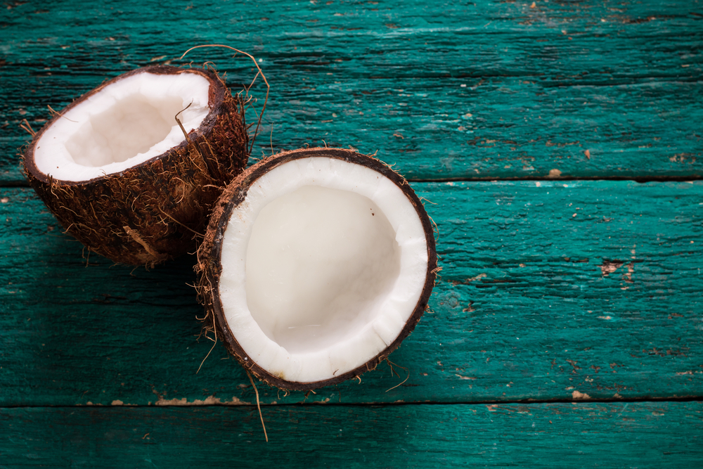 Coconut on wooden table.Organic healthy food concept.Beauty and SPA concept