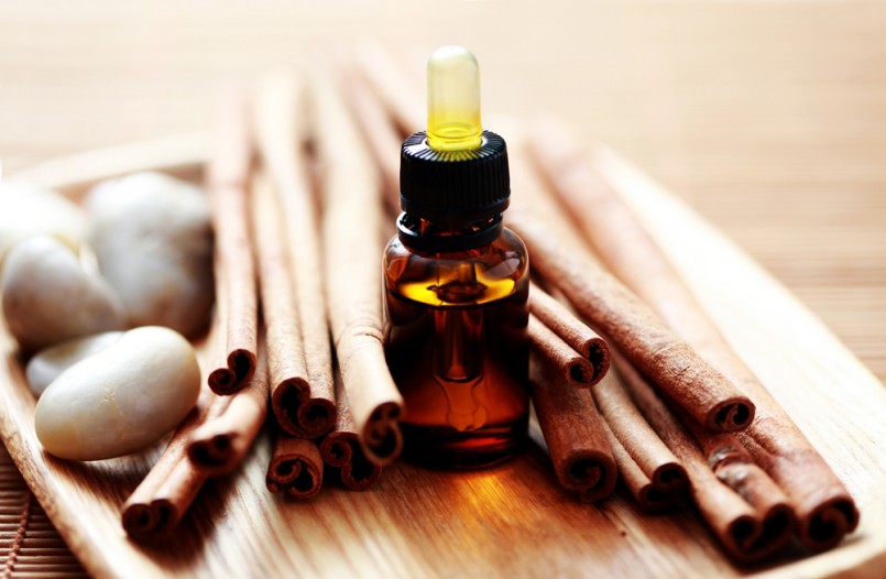 bottle of cinnamon essential oil - beauty treatment