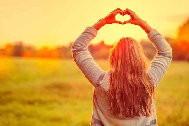 female-making-symbol-for-loving-the-season