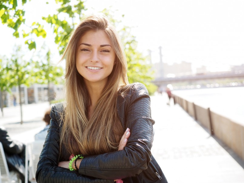 Portrait of pretty young woman. Looking at the Camera.
