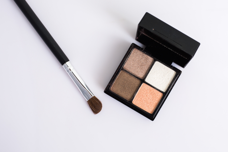 Eye shadow with brush on white background