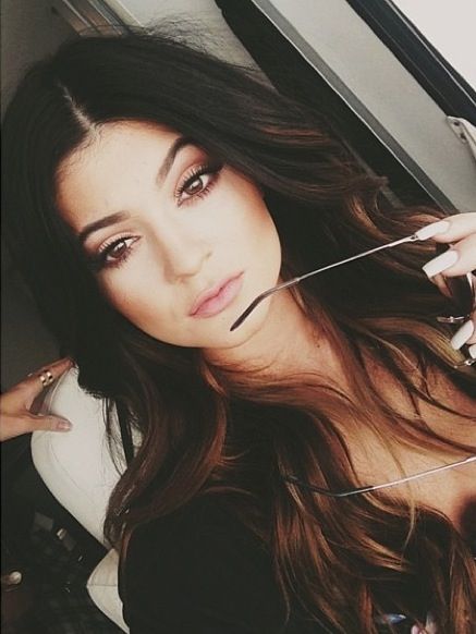 beautiful woman with dark brunette brown hair with low highlights balayage