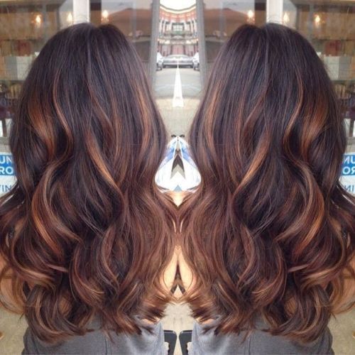 reddish highlights balayage wavy curly hair