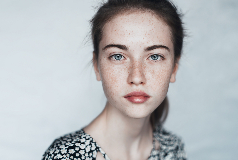 face of a beautiful young girl with a clean fresh face close up